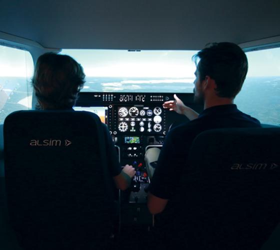 Aviation student and instructor in flight simulator