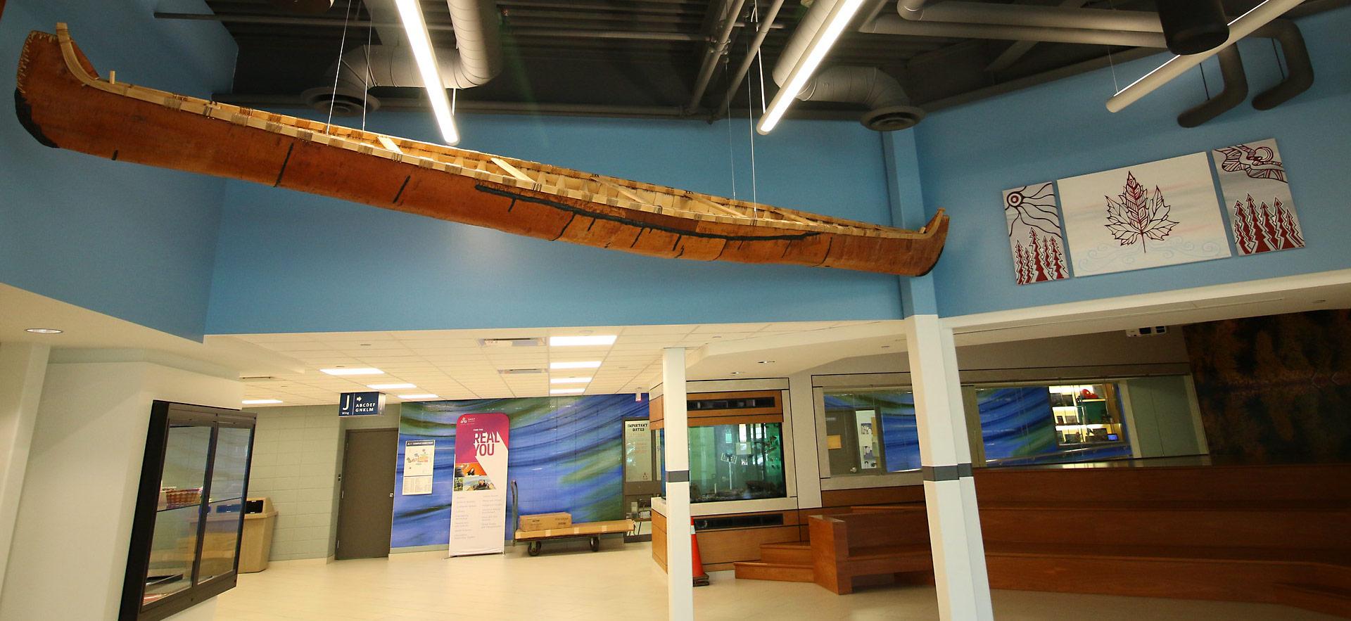 indigenous crafted canoe suspended in hall entry