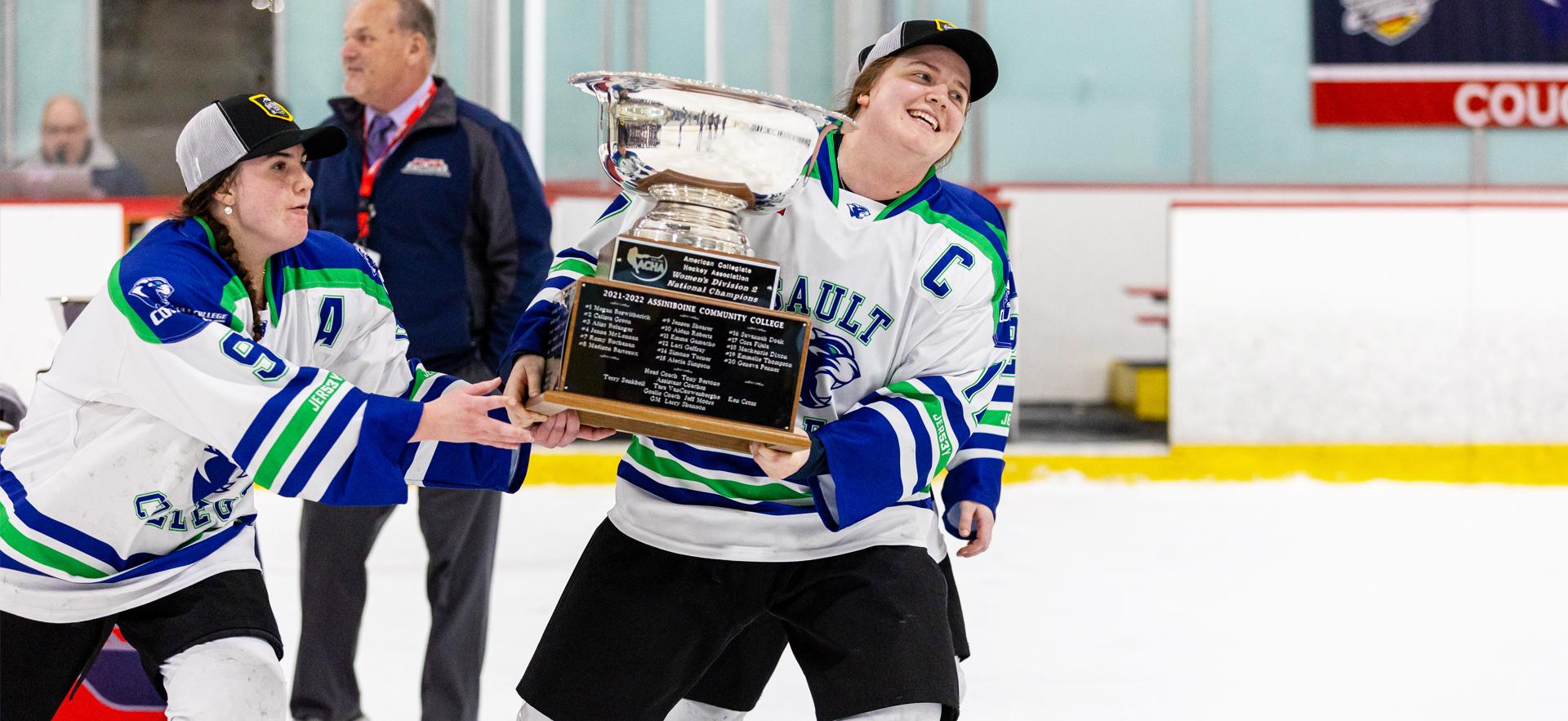 Women's ACHA Hockey Champions 2023 player holding trophy